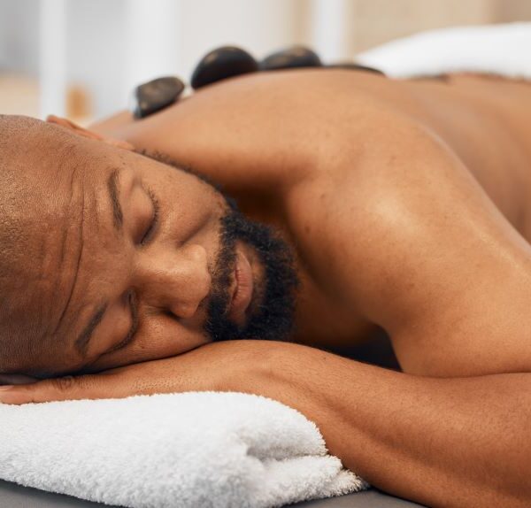 black-man-spa-bed-hot-stone-massage-and-relax-body